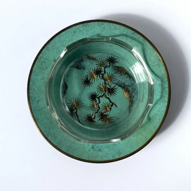 Rare Paul Haustein, WMF Ikora metal vide poche catchall with glass insert. The patinated green metal contrasts beautifully...