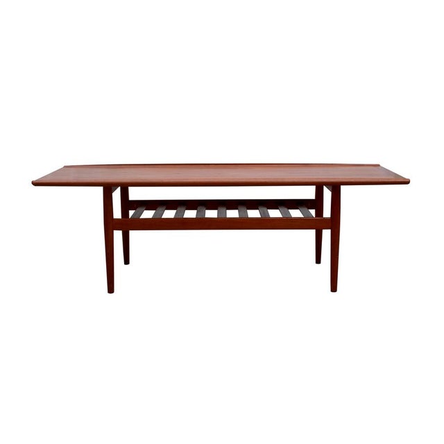 Classic 1960s coffee table, designed by Grete Jalk for Glostrup. Made of teak. Well-maintained condition with minor signs...