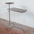 This early 20th-century infirmary table is a charming example of vintage industrial design, perfect for collectors of...