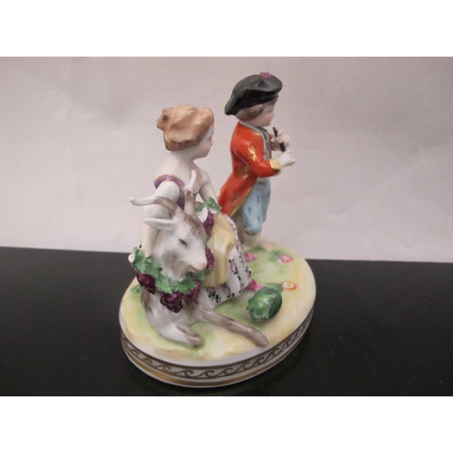 Beautiful vintage Dresden porcelain figurine. Finely detailed and hand painted showing figural scene of couple with a goat...