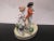 Beautiful vintage Dresden porcelain figurine. Finely detailed and hand painted showing figural scene of couple with a goat...