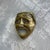 This decorative brass wall mask evokes the celebrated style of classical greco-roman theater. This vintage piece captures...