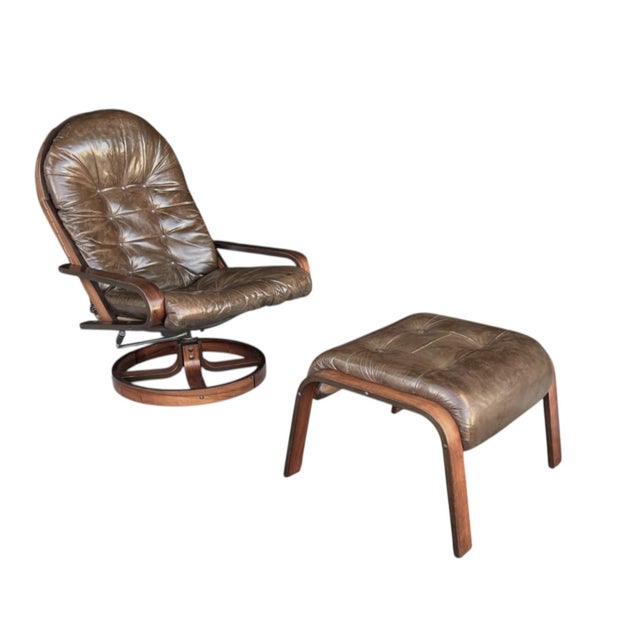 This exceptional vintage Scandinavian lounge chair and ottoman set by Rykken & Co., Norway beautifully showcases the...