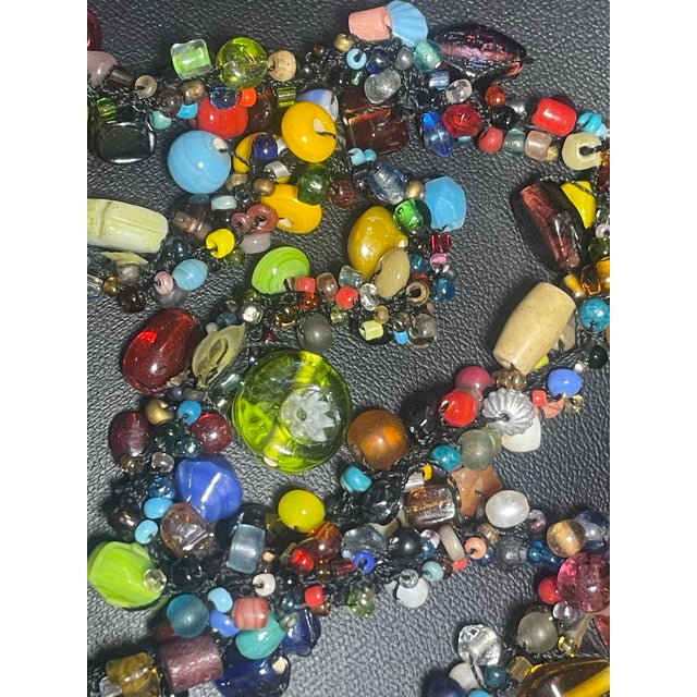 An exciting and historical necklace l, of many many varieties of antique Bohemia and Venetian influence. The press-molded...