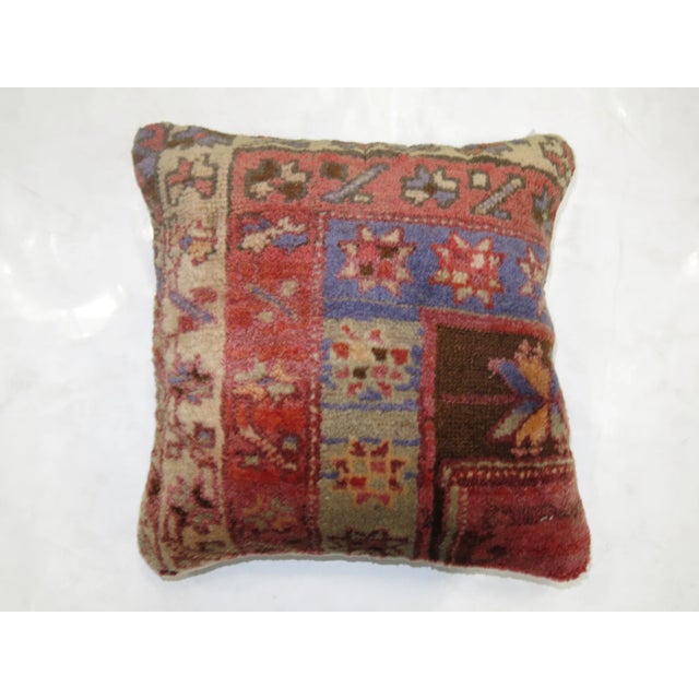 Pillow made from a vintage turkish rug with cotton back. Zipper closure and foam insert provided.