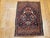 "An exquisite early 20th century Persian Isfahan miniature rug in a rare and enchanting pictorial vase design — a...