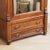 A single-door mirrored cabinet (bonnetière) made of walnut, crafted in the gründerzeit style around 1880. The...
