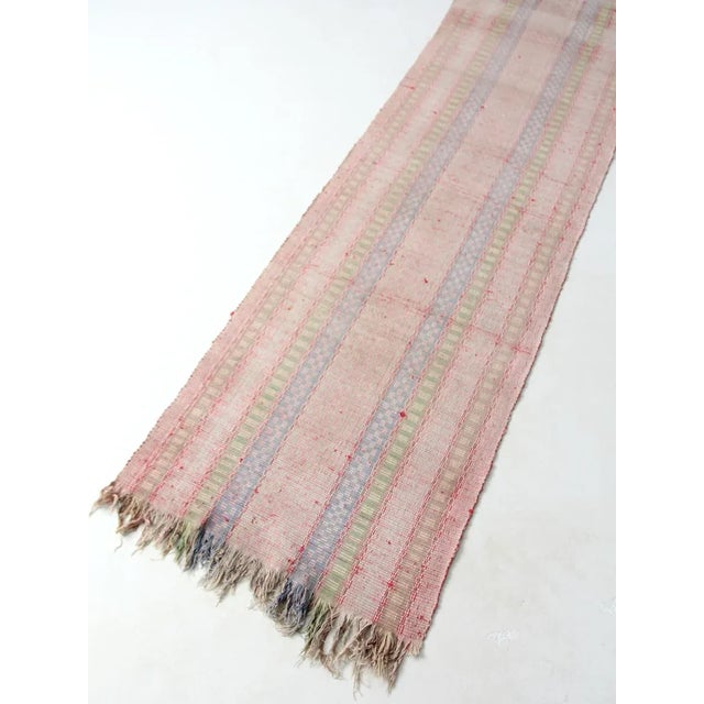 Rare size. A 1920s vintage Swedish floor runner (or trasmatta) featuring a pretty pink pastel pattern with blue and green...