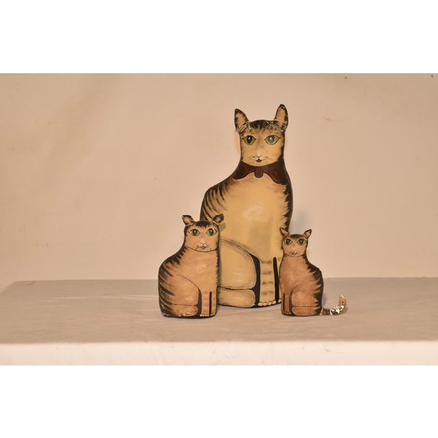 Signed M Burkette 1987 set of three carnival cats, made from canvas and hand painted. This set was made by Flora Mildred...