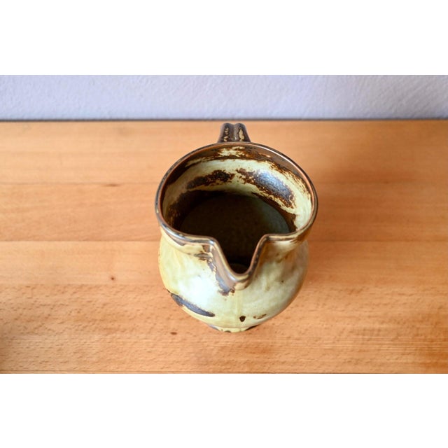 This beautifully crafted stoneware pitcher features a matte, subtly nuanced beige-to-brown glaze. A Sahara model from the...