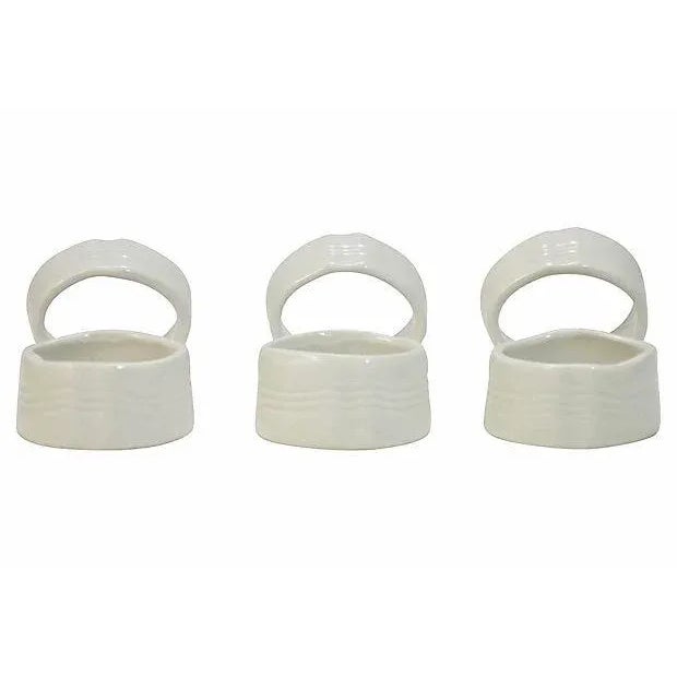 Vintage set of six antique white ceramic pottery napkin rings. No maker's marks. Light wear.