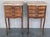 A pair of Antique French Louis XV Marquetry marble top nightstands. Subtle contours and scroll shapes are evident in the...