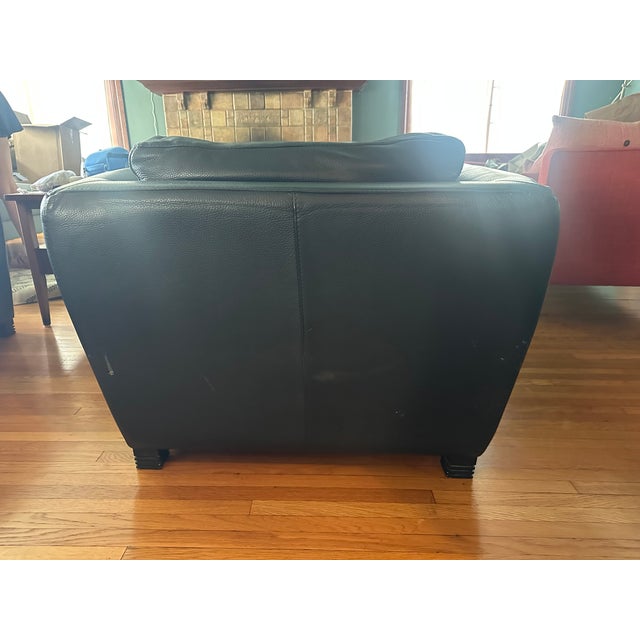 High-end pair of French designer Roche Bobois chairs made with ultra-soft, genuine black leather. Very comfortable with a...
