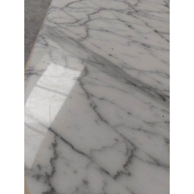 the table leg is discolored by the sun. The table top has a scratch on the edge. This is a beautiful table for people who...