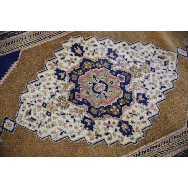 Introducing a one-of-a-kind vintage Turkish hand-knotted wool rug, carefully crafted by skilled artisans using traditional...