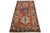 This handcrafted Kazak wool rug showcases a vibrant red palette with delicate blue, yellow, and beige accents. It is...