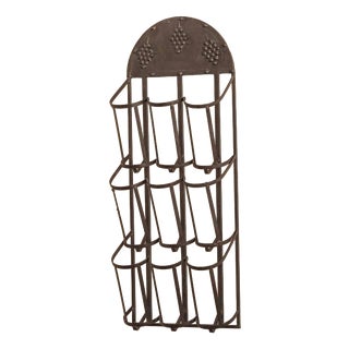 Wall-Mounted Metal Wine Rack with Grape Relief For Sale