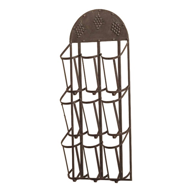 Wall-Mounted Metal Wine Rack with Grape Relief For Sale