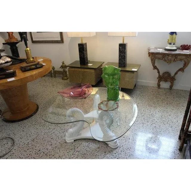 1970s Cocktail Coffee Table Wood White Lacquer Dolphin Base with Organic Design Beveled Glass Top . This stylish and chic...