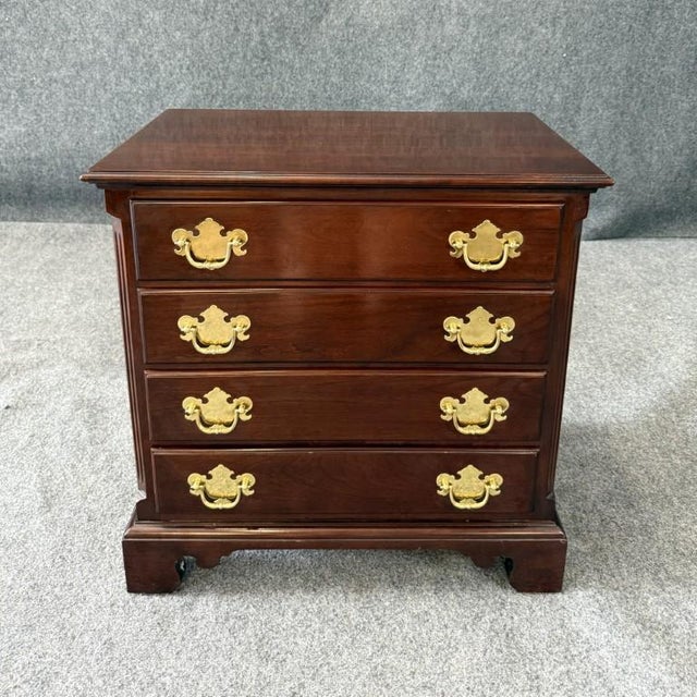 This Statton solid mahogany petite four-drawer nightstand features a rich traditional finish, classic bracket feet, and...
