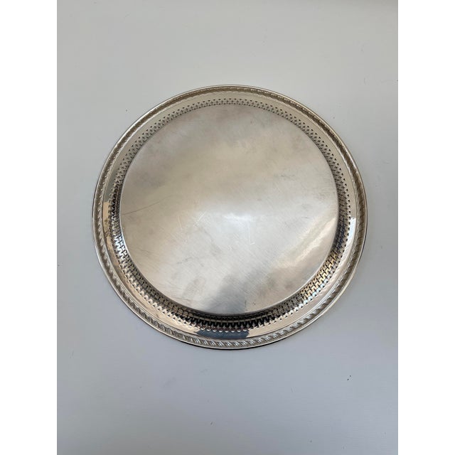 Vintage embossed Wm Rogers Sivlerplate serving tray with beautiful center design and pierced rim. Perfect for serving food...