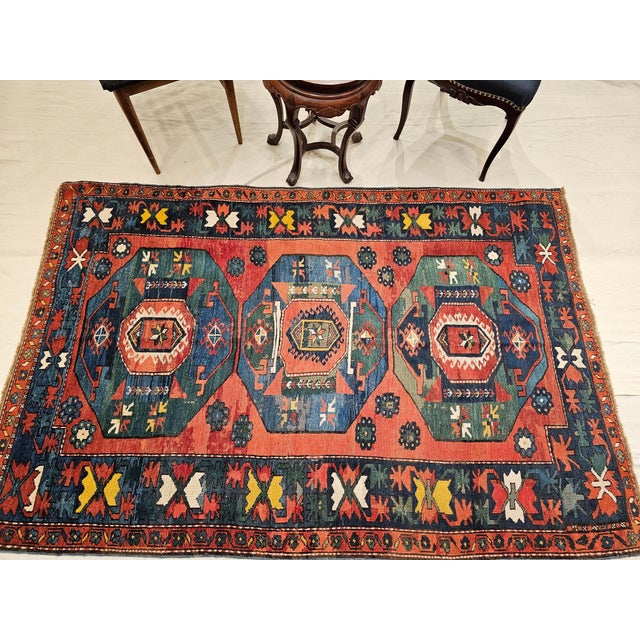 4’ 9” x 7’ 1” A beautiful late 19th century Caucasian Kazak with three medallions with wonderful abrash green and blue...