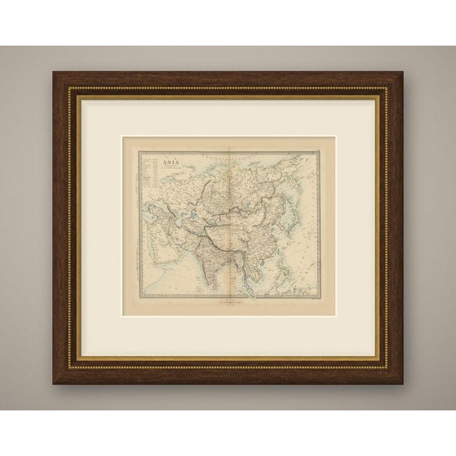 An original antique map of asia, a steel engraving colored by hand in outline, with a pale blue wash along the coasts and...
