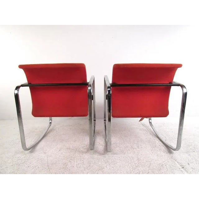 This vintage pair of chrome frame rocking chairs features the stylish design of Peter Protzmann as presented by Herman...