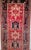"A remarkable and generously proportioned antique Persian Heriz Karajeh runner, handwoven in the early 20th century in the...