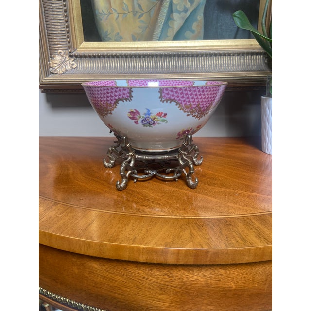 Beautiful decorative bowl with hand painted flowers , vines and fishnet scale motifs. Bowl includes brass stand....