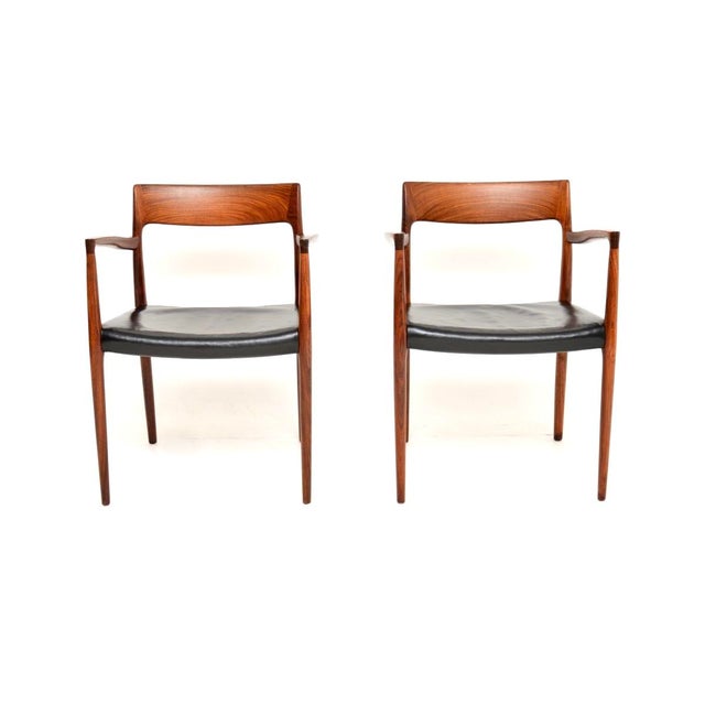 An exceptional pair of Danish vintage model 57 chairs by Niels Moller. They were made in Denmark by JL Moller Mobelfabrik,...