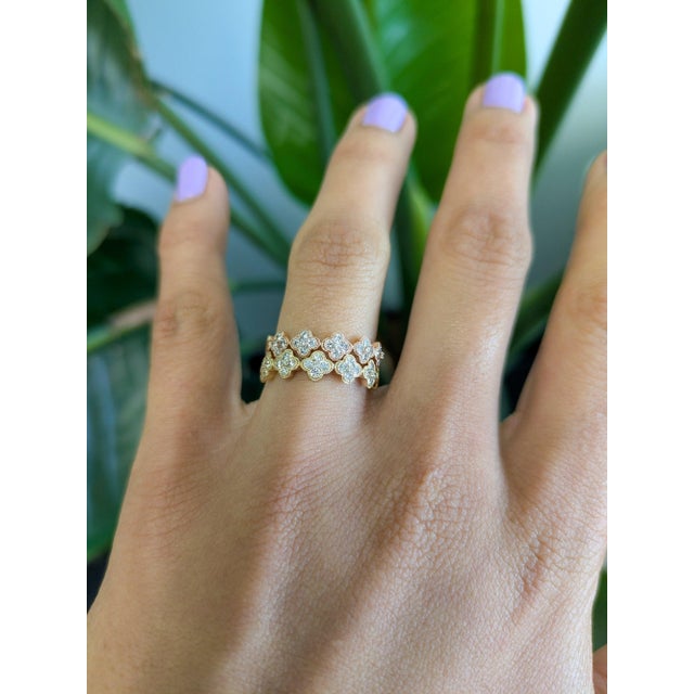Twenty-five earth-mined diamonds sparkle across this solid 14K yellow gold band, totalling 0.35 carats. Warm and...