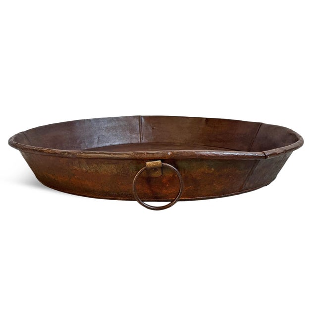 Vintage large rustic industrial style round iron tray from India. Hand-formed from heavy-gauge iron, its broad, shallow...