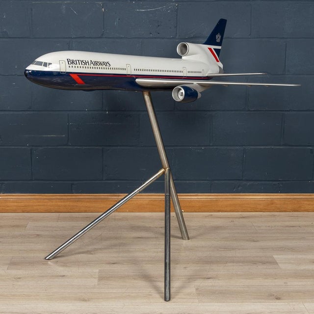 A stunning vintage fibreglass and plastic composite model of a Concorde in full British Airways livery mounted on a tripod...