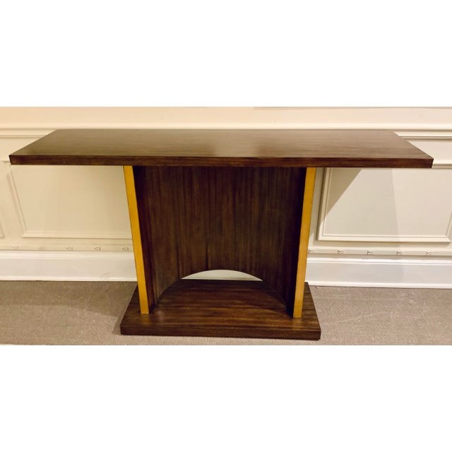 Stylish Theodore Alexander Modern Walnut Finished Marliss Console Table, gold accents, showroom floor sample
