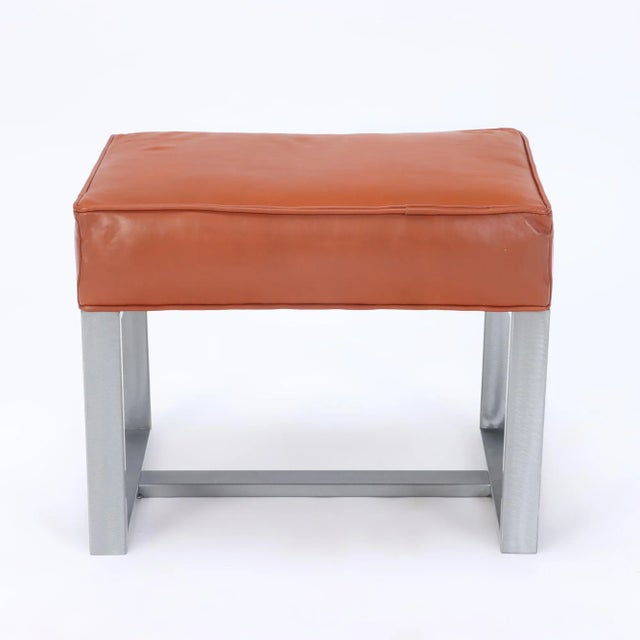 An elegant pair of chrome and leather covered benches or small stools. Contemporary