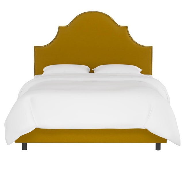 Classic curves wrapped in smooth upholstery, then accented with elegant ornamental nailheads, gives this Upholstered Bed...