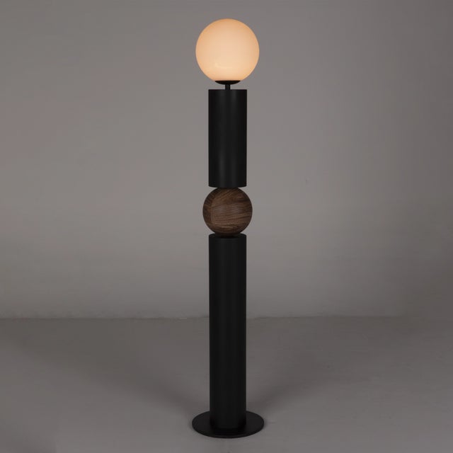Crafted from industrial-grade steel and frosted glass, the Max Floor Lamp combines durability with a touch of...