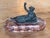 19th century French bronze female figure reclining against a cushion in loose drapery, a wreath of grapes and leaves in...
