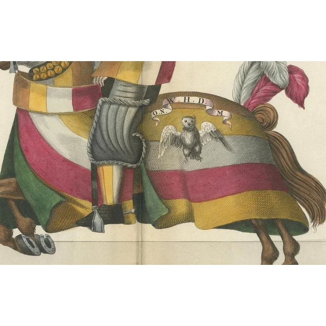 19th-Century Hand-Coloured Jousting Print: Heraldic Knights Charging in Contest This original hand-coloured lithograph,...
