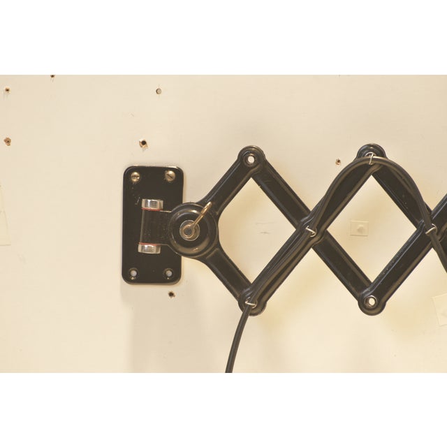 We offer a scissor-type wall light with a small shade from the exemplary idell lighting catalog. After wall mounting, the...