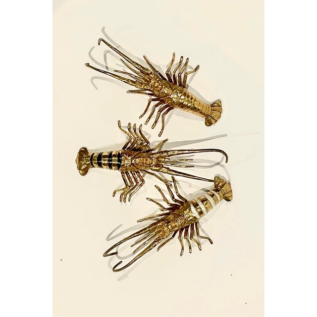 Decorative brass lobsters from Blue Carreon Home. These can be used as paperweights or decorative items on a coffee table...
