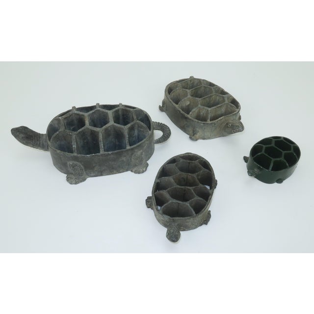 Frogs disguised as turtles! Charming set of 4 stacking metal flower frogs in the shape of turtles. The smallest one is...