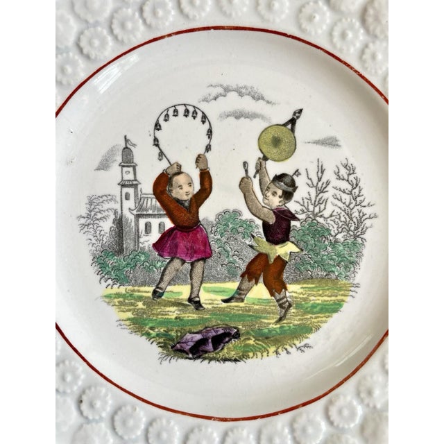 Stunning Pearlware plate featuring two Victorian children playing.