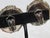 White metal and grey beads rolled into a ball cluster. Marked on the back under the clip-on. Matia Calderara, Italy circa...