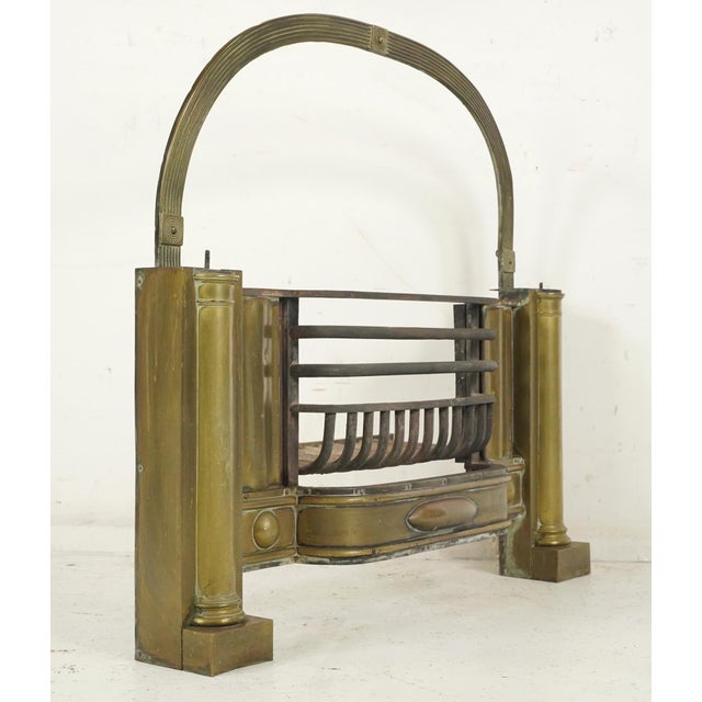19th century coal fireplace insert made of brass and cast iron. The central grate is made of iron, designed to hold coal...
