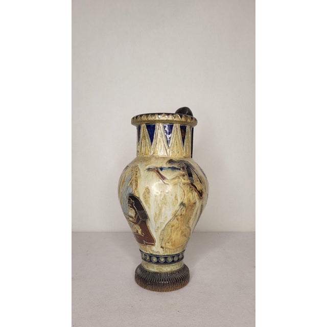 Large stoneware vase from the 1930s signed Roger Guerin. Antique decor of musicians. In perfect condition. This piece has...