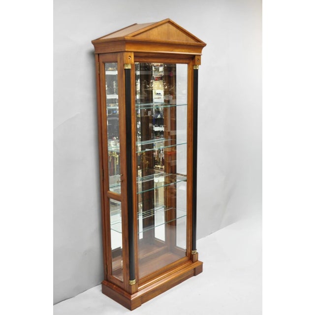 Ethan Allen Medallion Collection Cherry Wood Glass Curio China Cabinet with Black Columns. Item features two side entry...