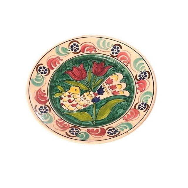 Bring a touch of rustic warmth and vibrant folk art to your interior with this charming vintage hand-painted terracotta...