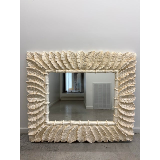 Striking vintage Hollywood Regency mirror in the style of Serge Roche, featuring a dramatic sculptural frame composed of...